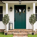 Large artificial curved branches of green plants simulate courtyard garden door W2945P278480