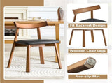 2 walnut colored solid wood dining chairs, with black PU soft cushions and curved backrests that fit W1151P436187