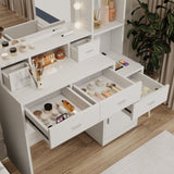 The white vanity with a mirror is equipped with a hair dryer rack, while the vanity in the bedroom W1320P186705