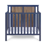 Connelly Mini Crib With Mattress Pad Midnight Blue/Vintage Walnut B022P204870